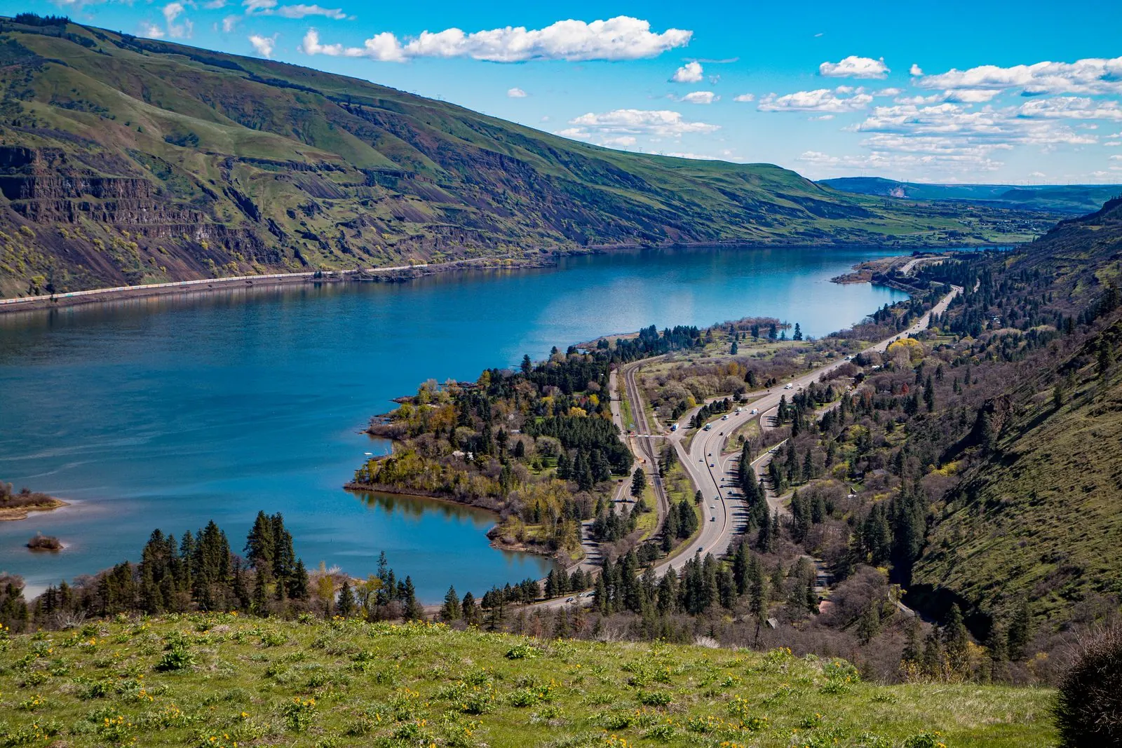 A wide river winding through the Columbia River Gorge, Oregon